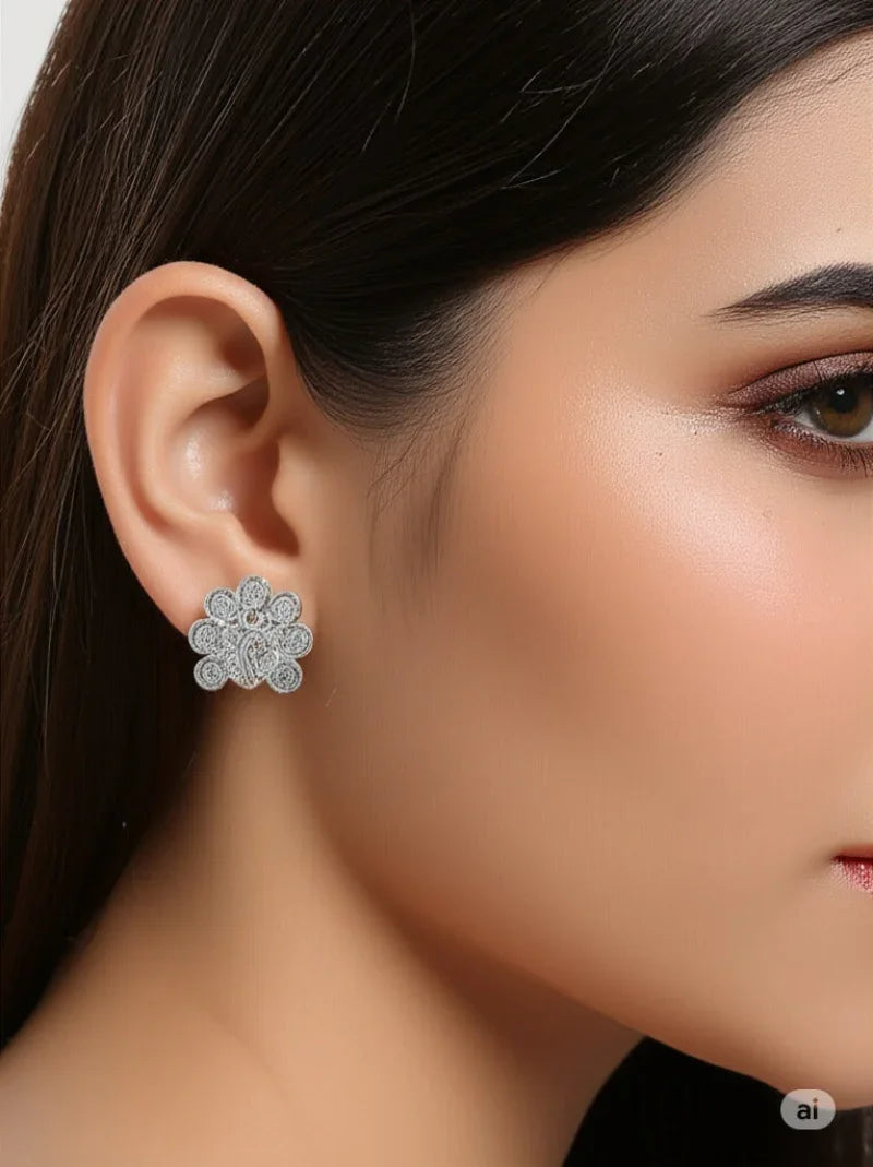 Close-up of a woman wearing a floral earring with a neutral background