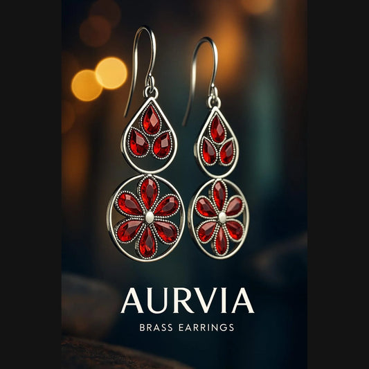 Aurvia brass earrings with red gemstones on a dark background