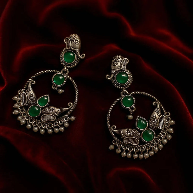 Close-up view of AURVIA oxidized chandbali earrings showing detailed craftsmanship and pearl drops