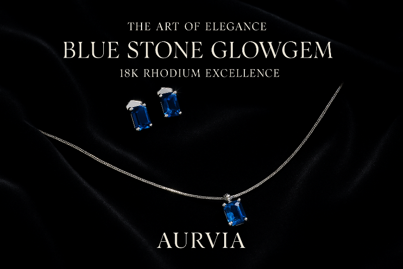 Jewelry set with blue stones and 'Aurvia' branding on a dark background